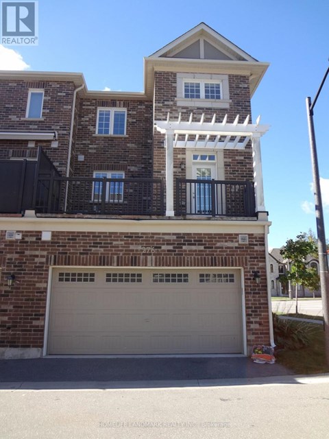 A two-story house with a garage is for sale.