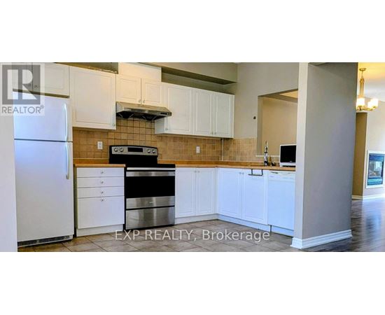 A kitchen with white cabinets and a stainless steel dishwasher.