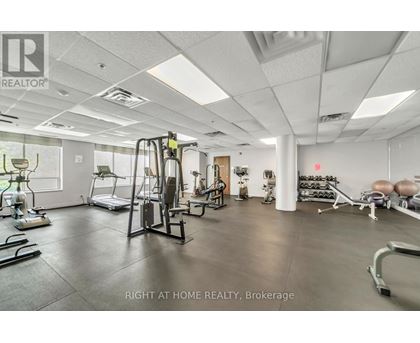 A gym with a variety of equipment is available at this Brokerage realty.