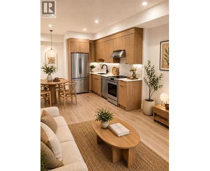 A modern kitchen with wooden cabinets and a refrigerator.