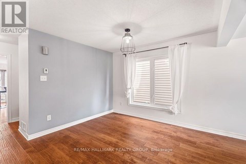 A room with wooden floors and white walls.