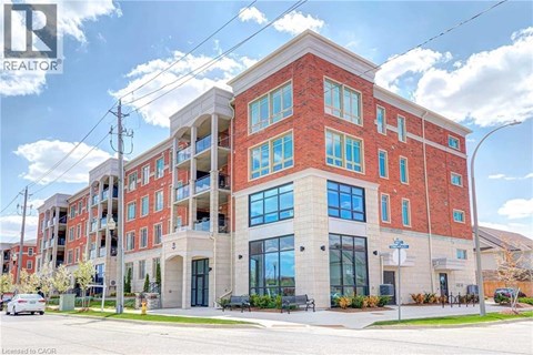 A large red brick building with a glass entrance and a sign that says REALTOR.