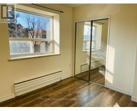 A room with a window and a sliding door.
