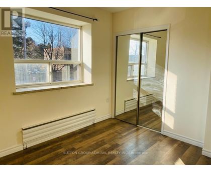 A room with a window and a sliding door.