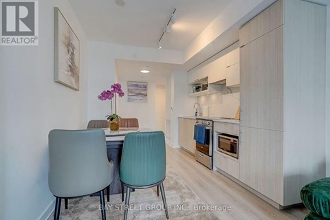 A dining area with a table and two chairs.