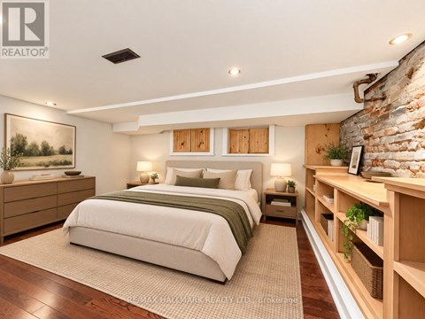 A bedroom with a large bed, a nightstand, and a wooden shelf.