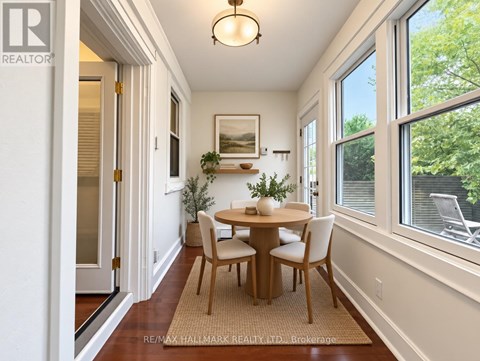 A dining room with a table set for two.