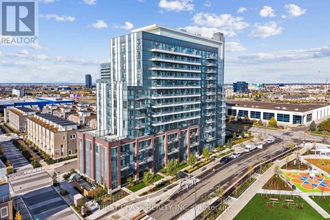 A modern multi-story building with a glass facade is the focal point of the image.
