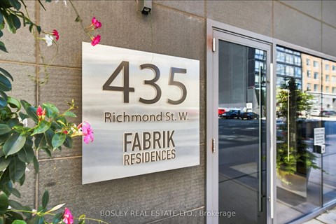A sign for Fabrik Residences is displayed on a building at 435 Richmond St. W.