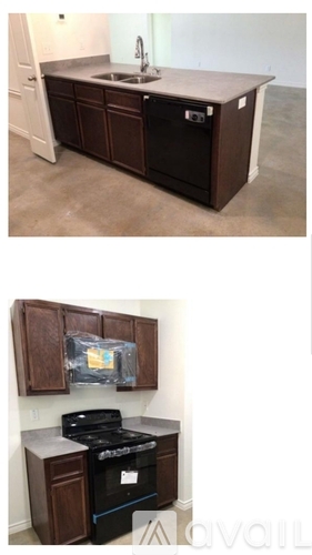 A kitchen with brown cabinets and a black stove top oven.