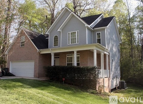 A house with a garage and a covered porch.