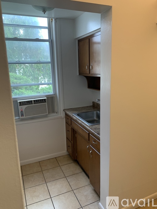 A kitchen with a window and a sink.