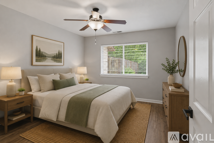 A bedroom with a bed, a ceiling fan, and a window with blinds.