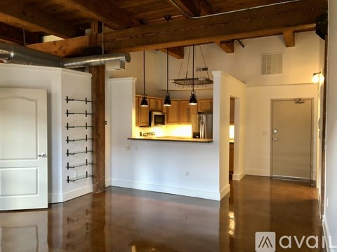 A room with a wine rack and a bar area.