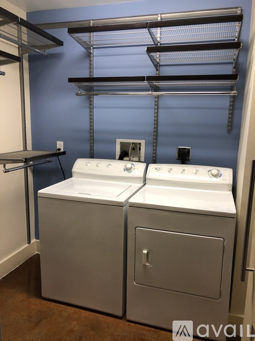 A wall-mounted shelf with two sinks below it.