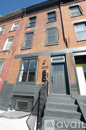 A brown building with the number 2835 on the front door.