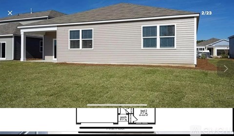 A house with a garage and a driveway.
