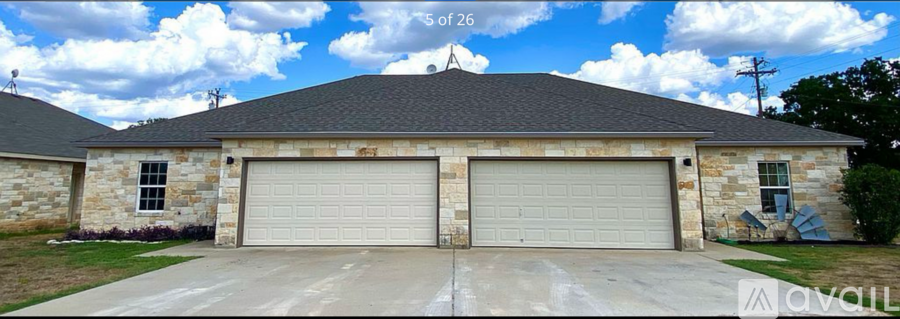 A two-car garage is attached to a house.