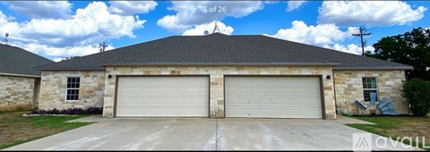 A two-car garage is attached to a house.