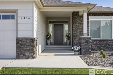 A house with the number 2456 on the front door.