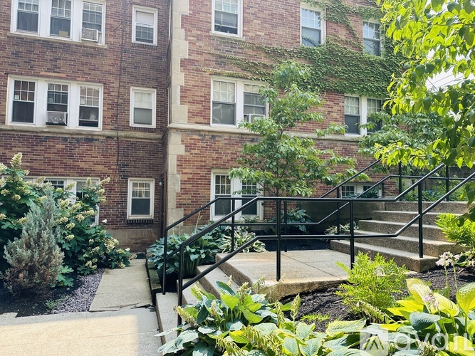 A building with a staircase in front of it.