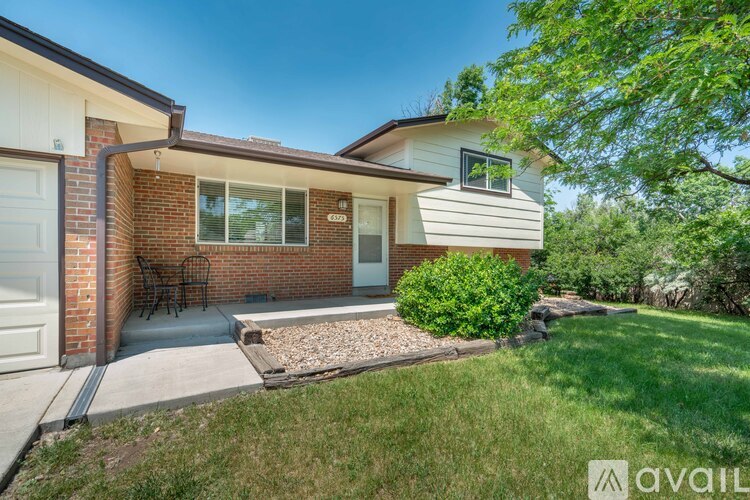 A house with a brick exterior and a white garage door.