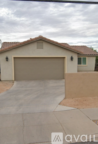 A house with a garage and a driveway.