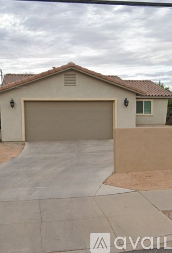 A house with a garage and a driveway.