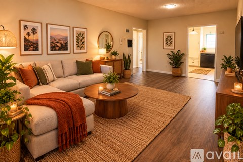 A living room with a couch, a coffee table, and a rug.