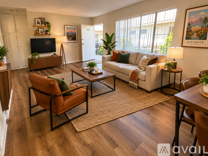A living room with a sofa, armchair, and coffee table.