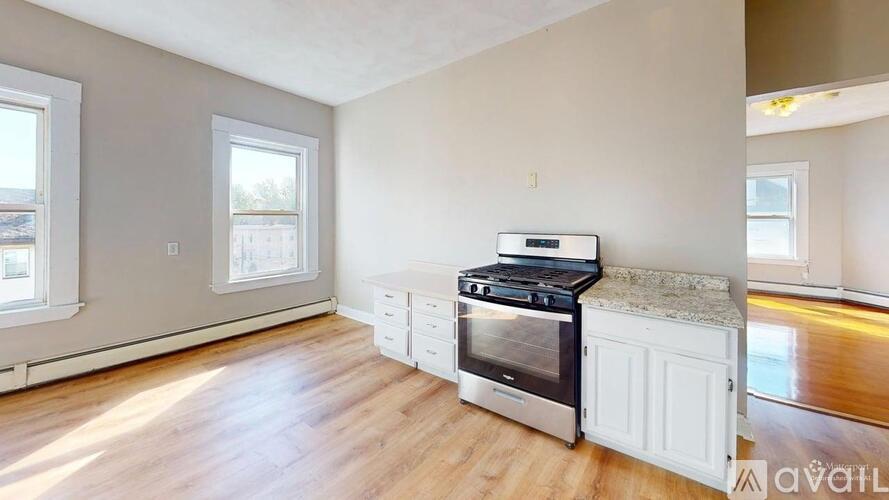 A kitchen with a stove top oven and a counter top.