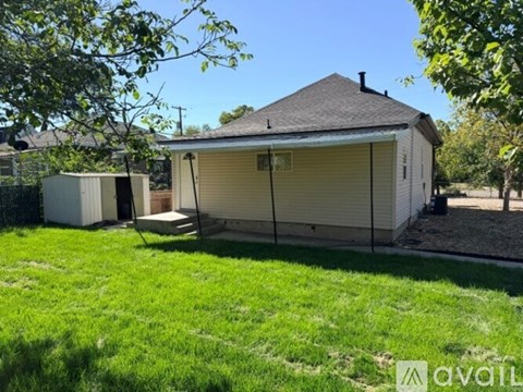 A house with a garage and a shed is for sale.
