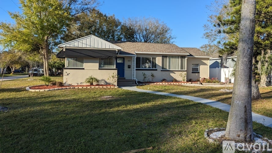 A house with a lawn in front of it.
