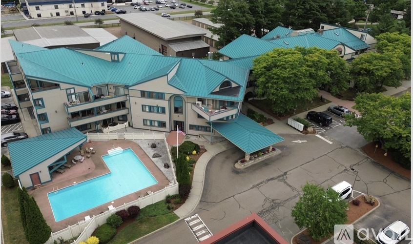 A large building with a pool in the middle of it.