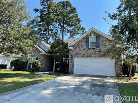 A house with a white garage door is for sale.