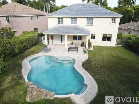 A house with a pool in the backyard.