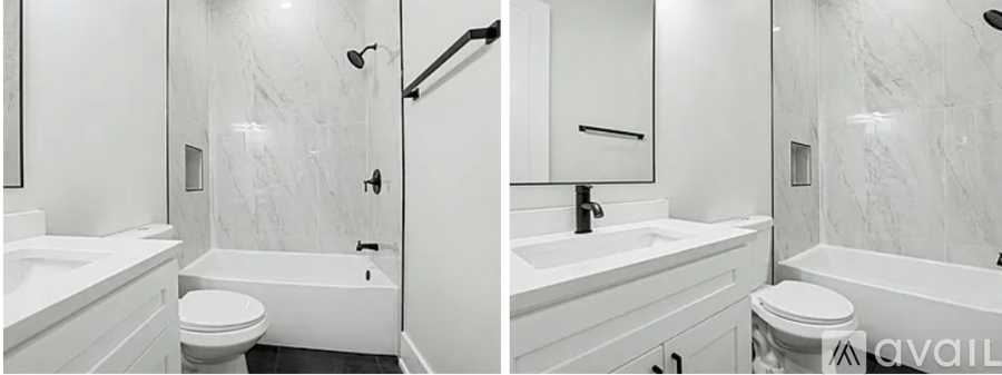 A bathroom with a marble wall and a white tub.