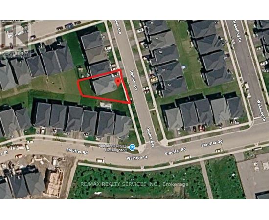 A satellite image of a residential area with a red box drawn on it.