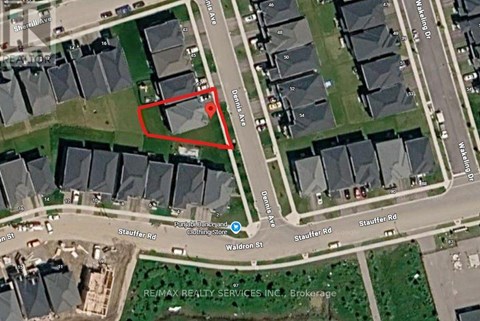 A satellite image of a residential area with a red box drawn on it.