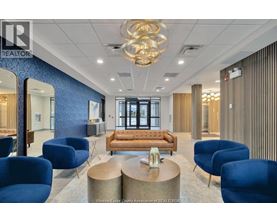 A modern office space with blue chairs and a wooden sofa.
