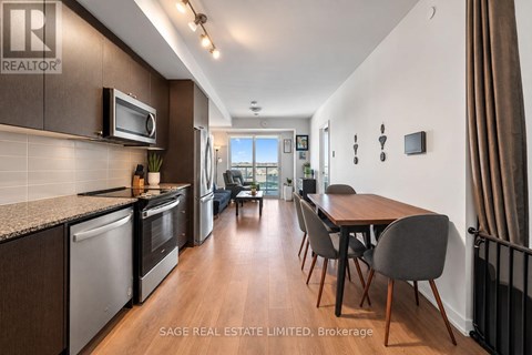 A modern kitchen with a dining table and chairs.
