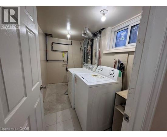 A laundry room with a washer and dryer.