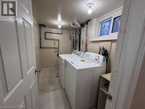 A laundry room with a washer and dryer.