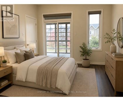 A bedroom with a large bed and a window overlooking a red building.