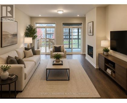 A living room with a white couch, a coffee table, and a flat screen TV.