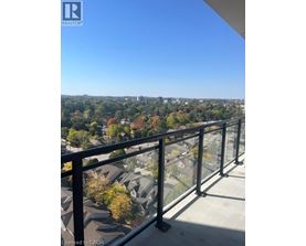 A balcony with a view of a residential area.