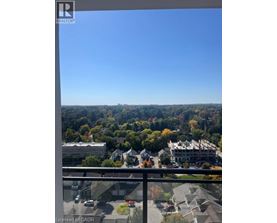 A view from a balcony overlooking a residential area.