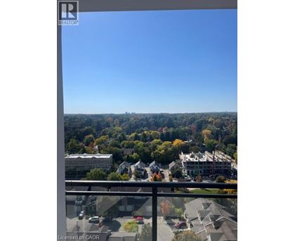 A view from a balcony overlooking a residential area.