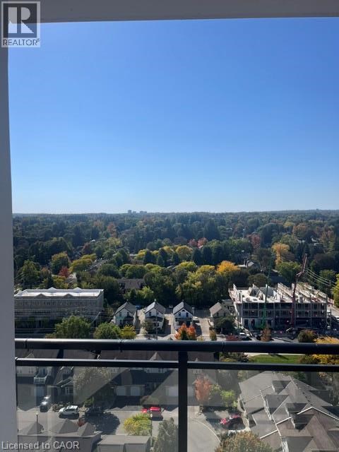A view from a balcony overlooking a residential area.
