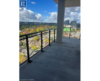 A balcony with a view of a city skyline.